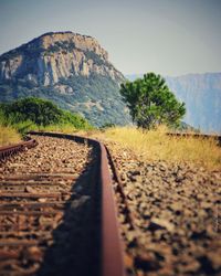 Surface level of railroad track against sky