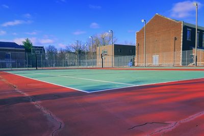 View of soccer field against blue sky