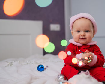 Portrait of cute baby girl with teddy bear