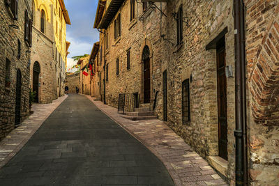 Narrow street amidst buildings in city