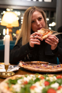 Young woman having food