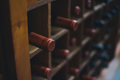 Close-up of wine bottles on shelf