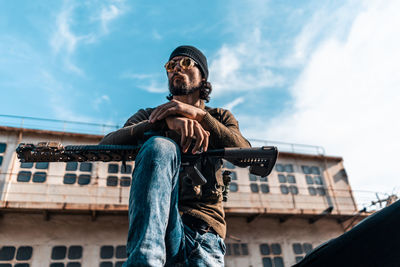 Low angle view of man against sky