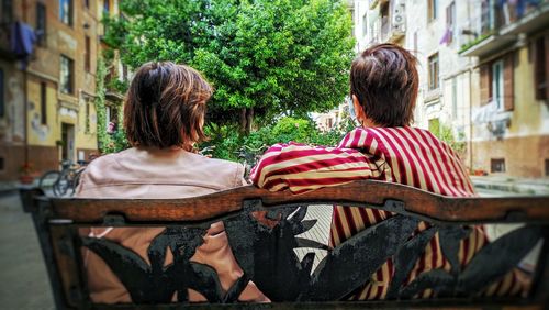 Rear view of couple sitting on seat