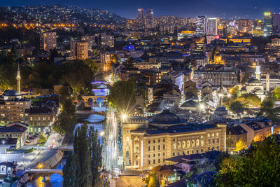 High angle view of illuminated buildings at night