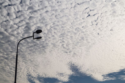 Low angle view of street light against sky