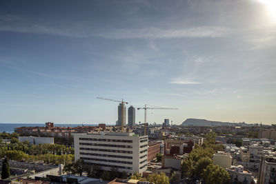 Buildings in city against sky