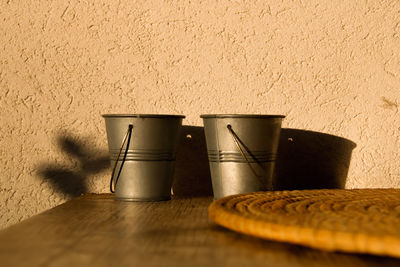 Close-up of bread on table against wall