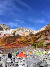 Scenic view of mountains against cloudy sky