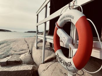 Close-up of life belt on beach