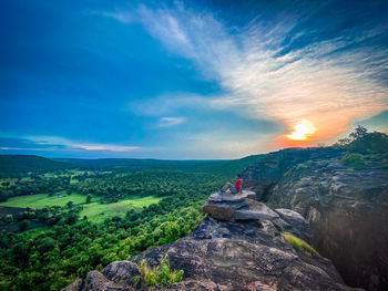 Scenic view of mountain against cloudy sky