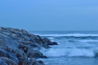 Scenic view of sea against clear blue sky