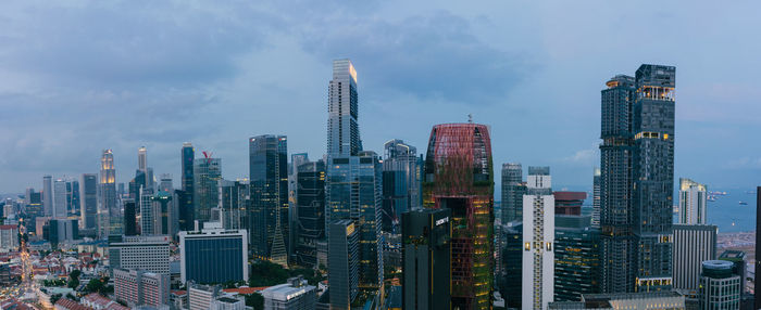 Panoramic view of buildings in city against sky