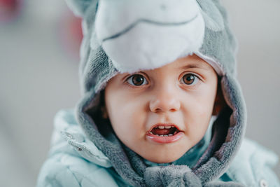 Portrait of cute boy in warm clothing