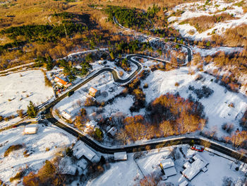 High angle view of cars on street during winter