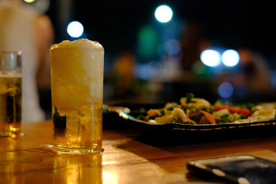 Close-up of beer in glass on table
