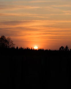 Scenic view of silhouette trees against sky during sunset