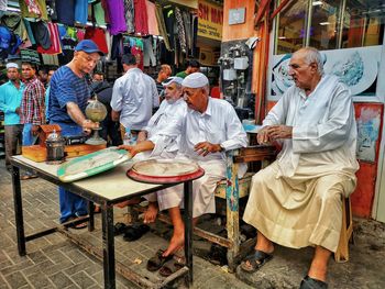 Group of people at market stall