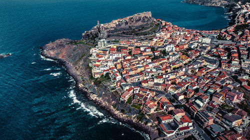 High angle view of townscape by sea