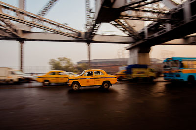 View of yellow car on road