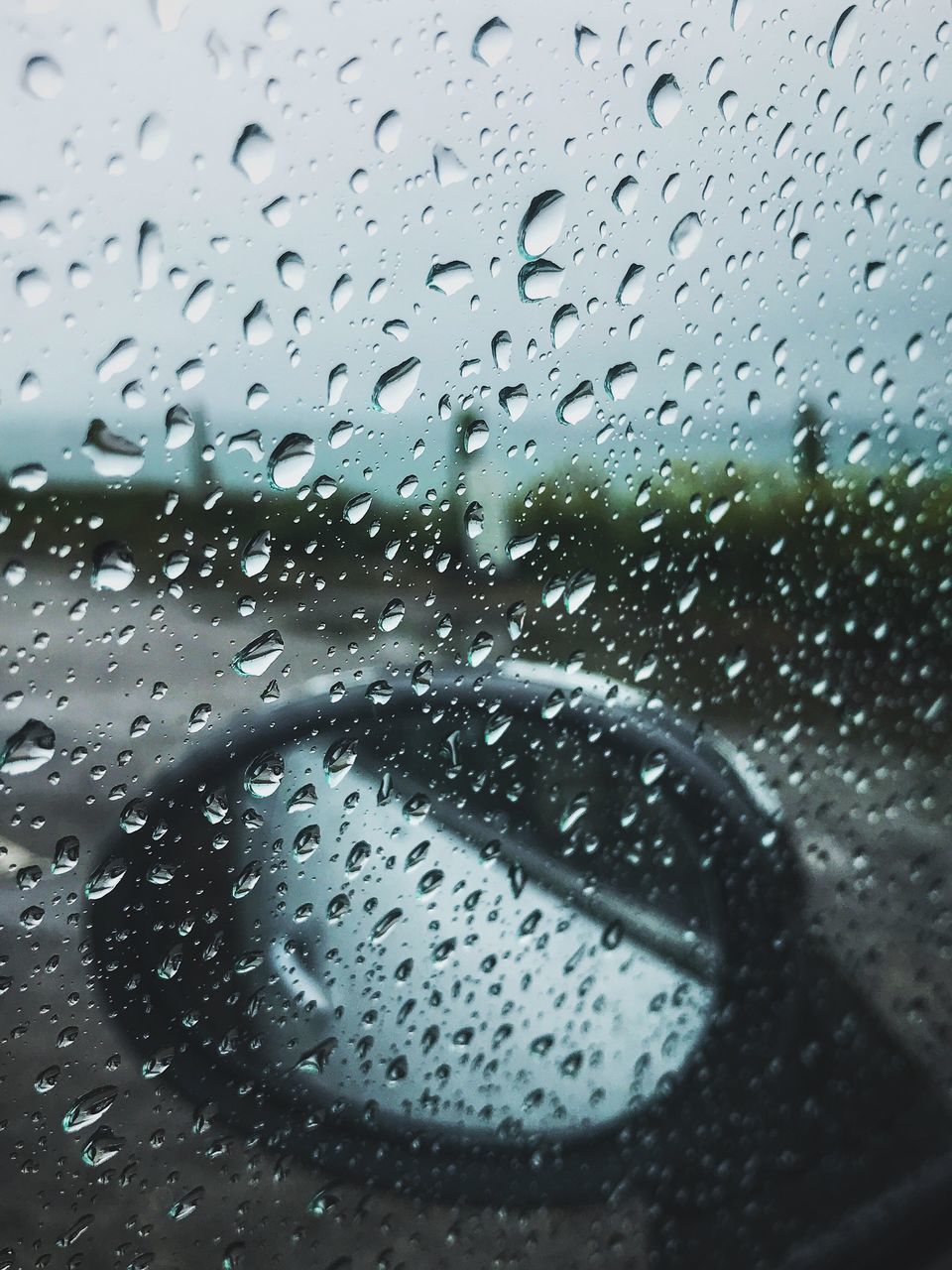 drop, window, wet, transparent, glass - material, rain, raindrop, water, weather, rainy season, no people, water drop, indoors, droplet, day, land vehicle, close-up, car, side-view mirror, car interior, focus on foreground, looking through window, backgrounds, nature, sky