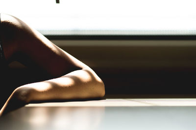 Low section of woman sitting on floor