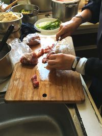 Cropped image of woman eating food