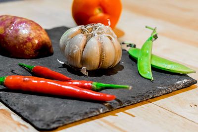 Close-up of chili peppers on table