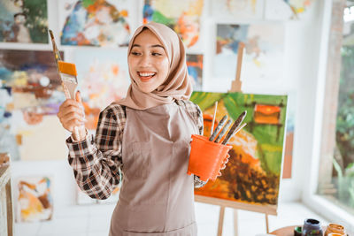 Portrait of young woman using mobile phone