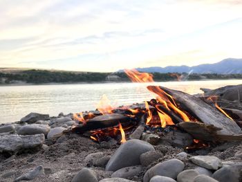 Close-up of bonfire at sunset