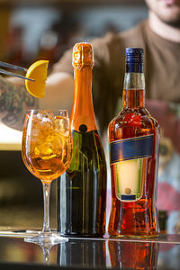 Close-up of wine bottles on table