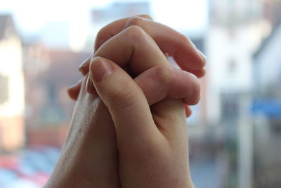 Close-up of man holding hands