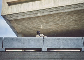 Low angle view of bird perching on steps