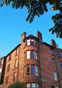 Low angle view of building against blue sky