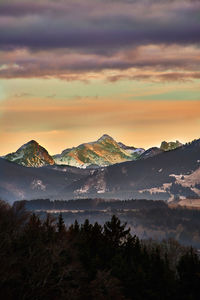 Scenic view of mountains against dramatic sky