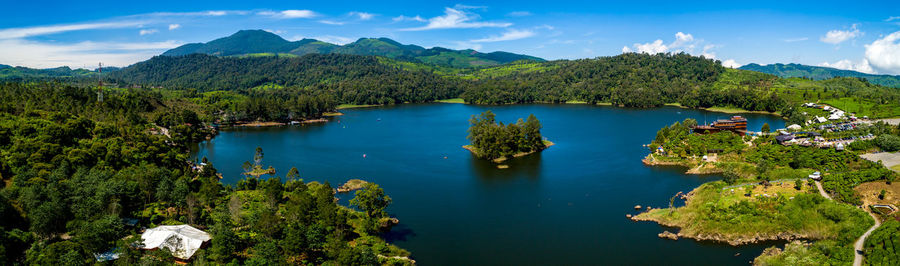 Scenic view of lake and mountains against sky