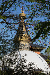 Low angle view of bell tower against sky