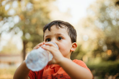 Child drinking water from bottle