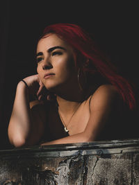 Portrait of young woman looking away