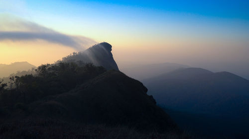 Scenic view of mountains against sky during sunset