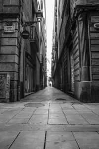 Road amidst buildings in city