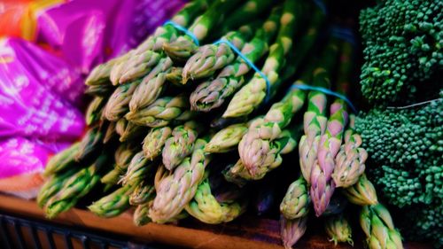 Close-up of asparagus and broccoli for sale at market