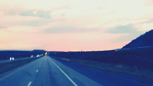 Road against sky during sunset