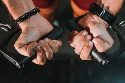 Close-up of man holding hands