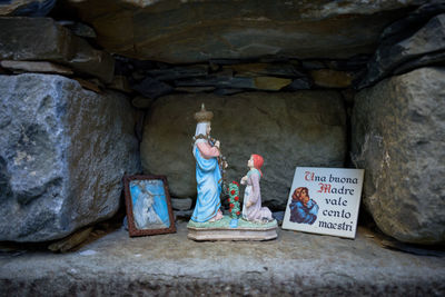 People sitting on rock