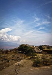 Scenic view of landscape against cloudy sky