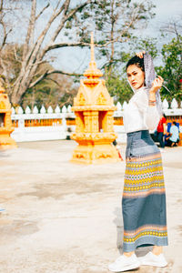 Woman standing at temple