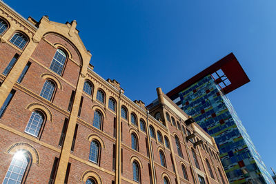 Low angle view of building against blue sky