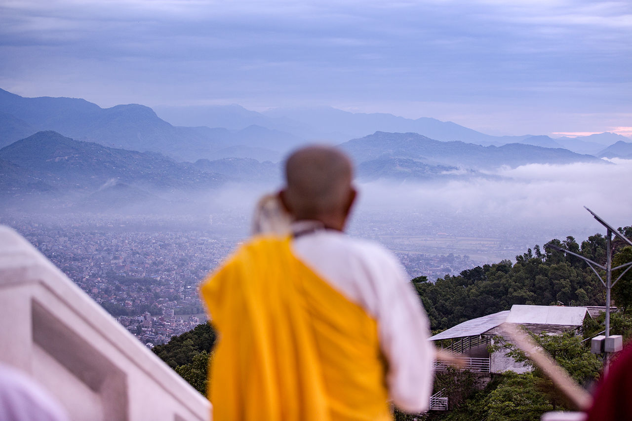 rear view, mountain, lifestyles, leisure activity, sky, person, men, waist up, looking at view, casual clothing, beauty in nature, mountain range, standing, nature, cloud - sky, togetherness, three quarter length