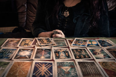 High angle view of woman hand on table